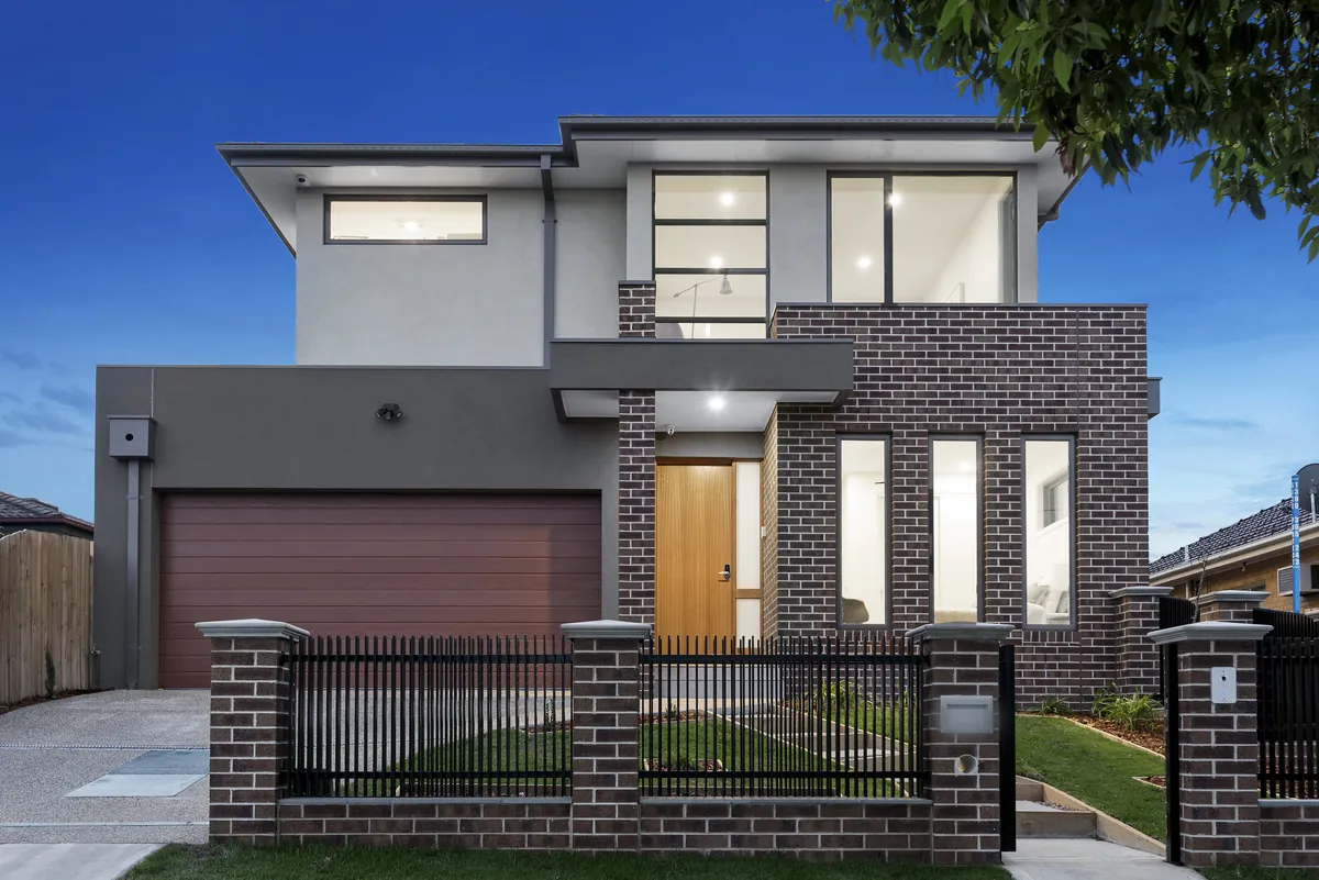 Double-storey VD Homes residence at dusk, Melbourne